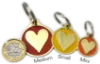 	Heart-shaped engraved dog tag with custom details on a UK dog collar